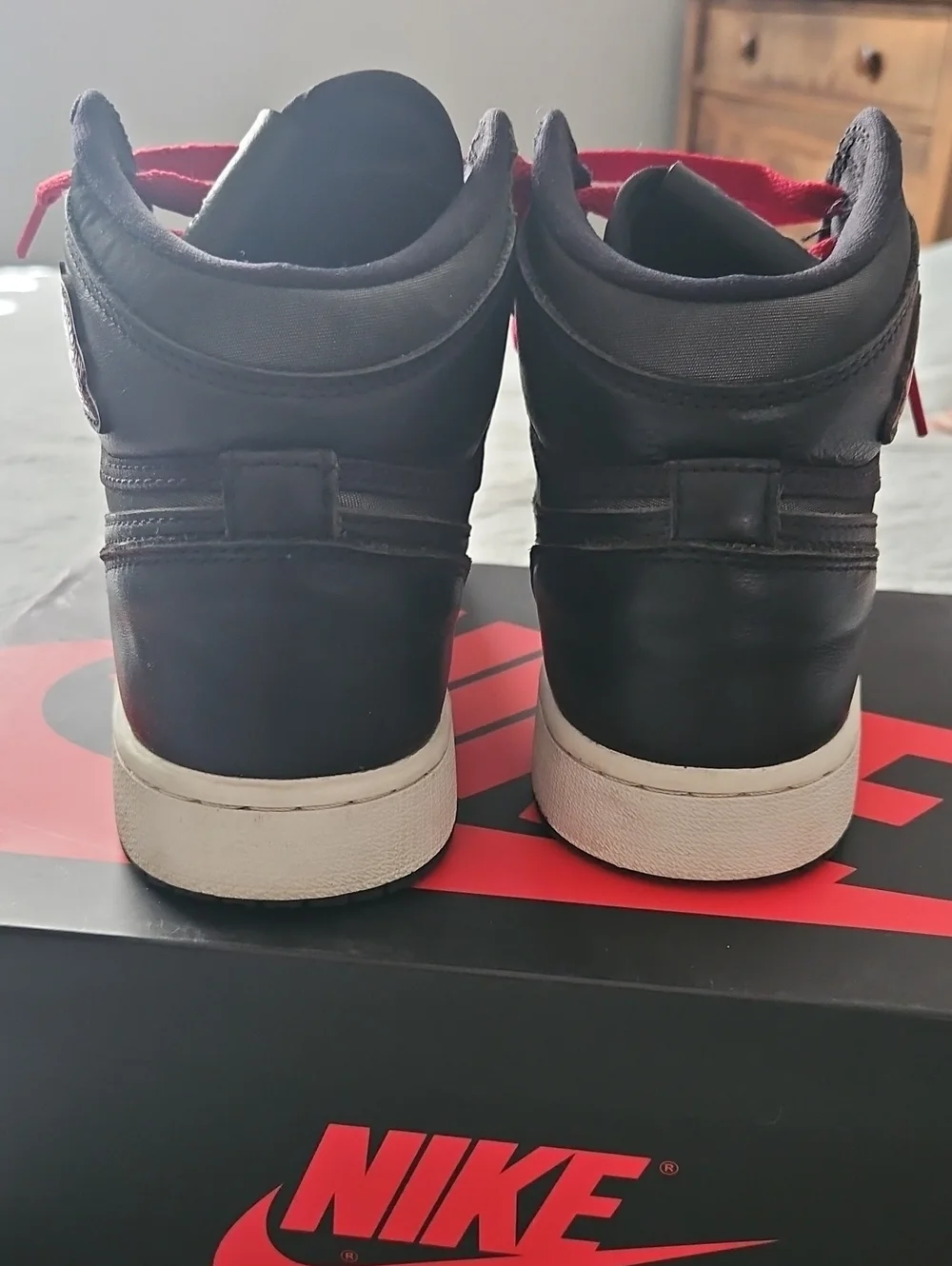 Nike Youth Black High-Top Sneakers with Red Accents